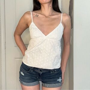 Brandy Melville White Camisole with floral and bow detail and tie on back.